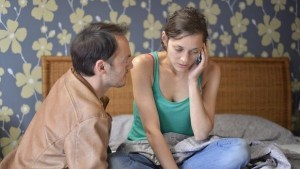 Manu (Fabrizio Rangione) encourages Sandra (Cotilliard) to make a call. 