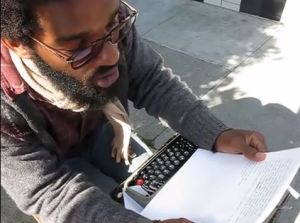 Gentry reading one of his poems to a patron