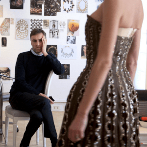 Raf Simons examines one of his creations