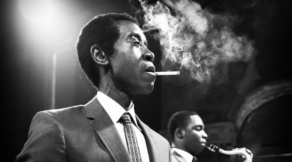 Don Cheadle as Miles Davis